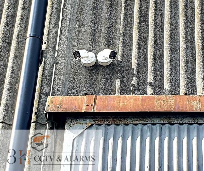Hikvision bullet cameras installed on commercial unit exterior