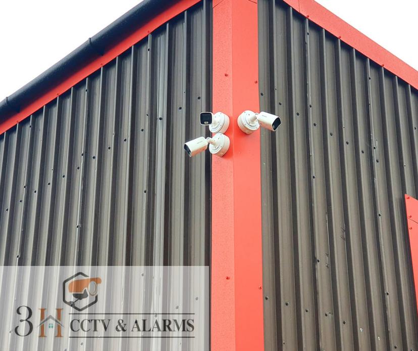 Three Hikvision bullet cameras on commercial property