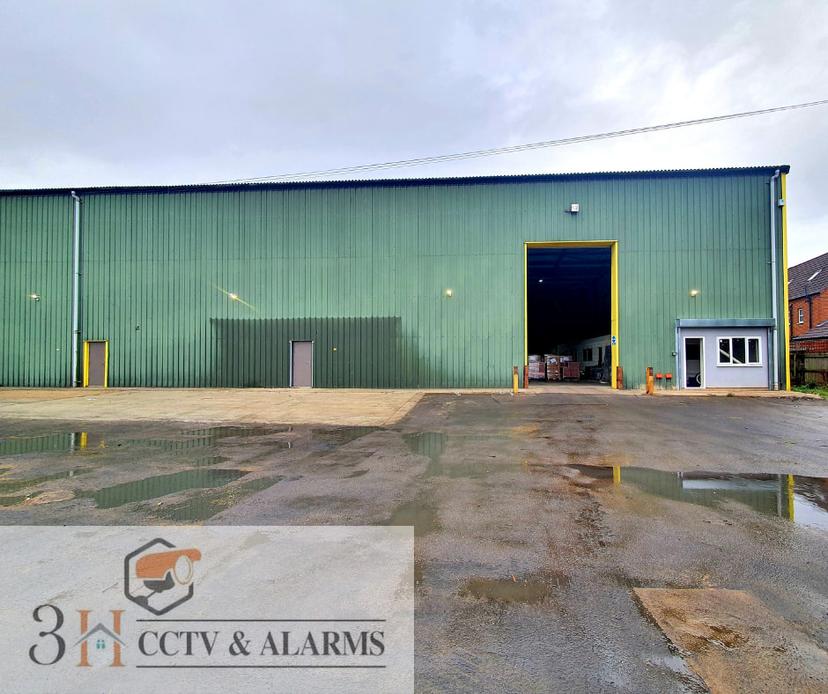 Three LED security lights installed on commercial units
